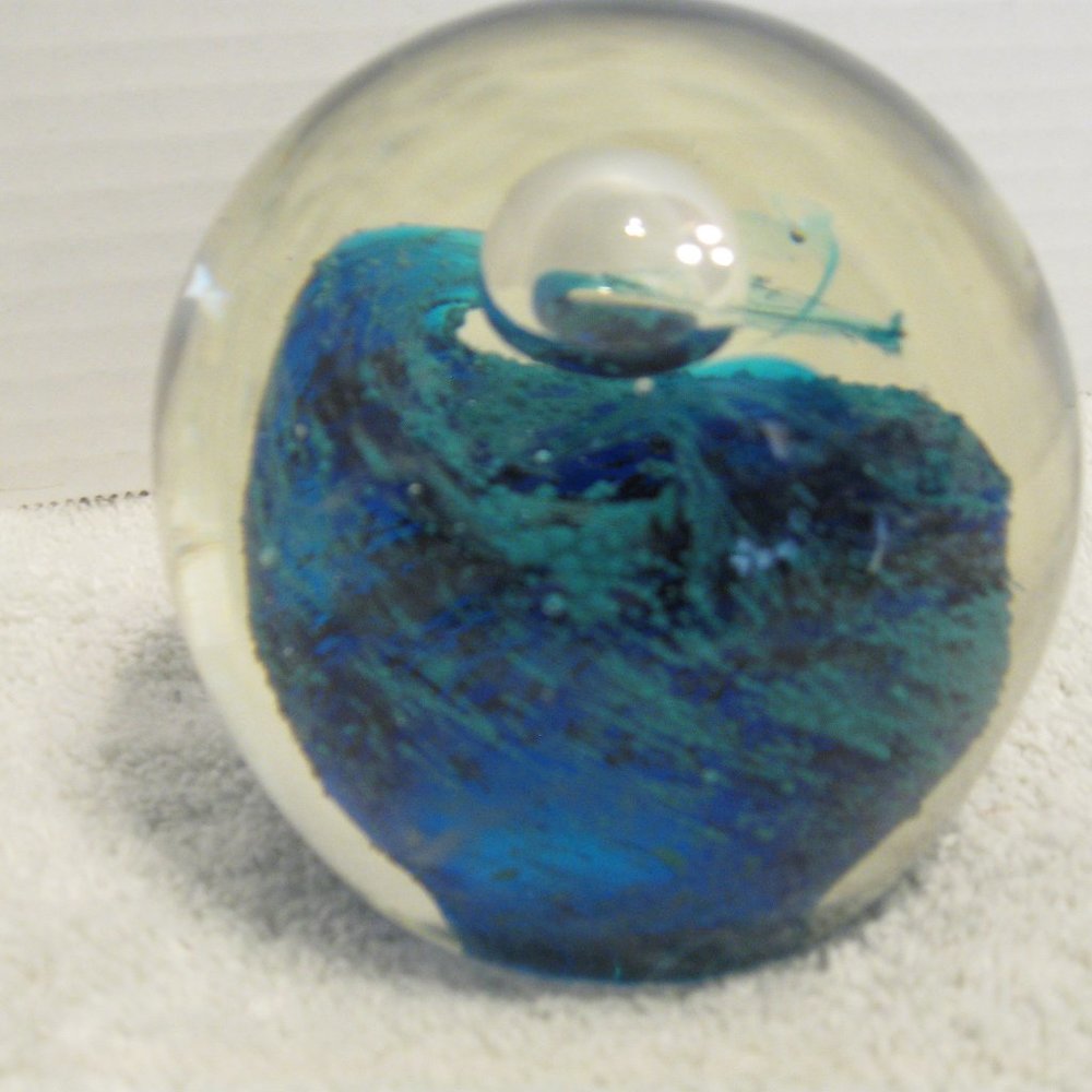 Beautiful Paper Weight with blues and greens in swirling ocean.